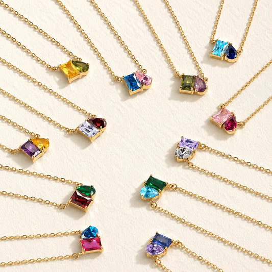 Collection of Lizabetha Parker gold birthstone necklaces with colorful gemstones