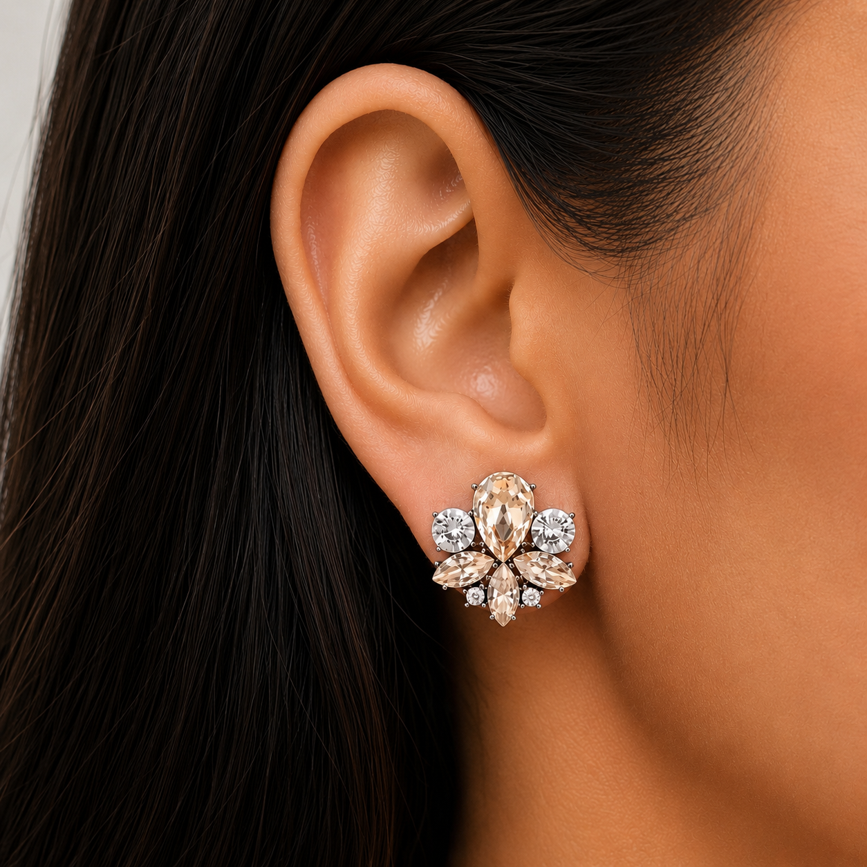 Model wearing champagne crystal floral stud earrings with pear, marquise and round-cut crystals, perfect for brides, bridesmaids and everyday wear.
