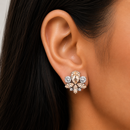 Model wearing champagne crystal floral stud earrings with pear, marquise and round-cut crystals, perfect for brides, bridesmaids and everyday wear.